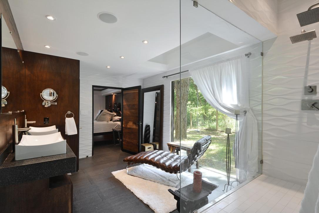 Frameless glass shower with a full height panel